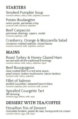 Christmas party menu showcasing a selection of appetizers, main courses, and desserts, including options like turkey, salmon, and vegetarian dishes, accompanied by festive decorations and elegant typography.